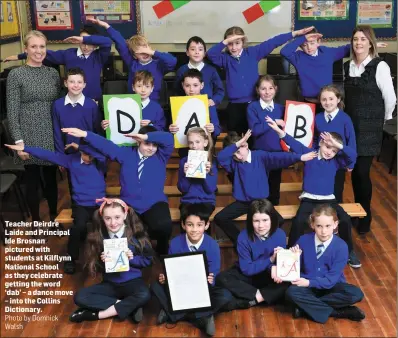  ?? Photo by Domnick Walsh ?? Teacher Deirdre Laide and Principal Ide Brosnan pictured with students at Kilflynn National School as they celebrate getting the word ‘dab’ – a dance move – into the Collins Dictionary.