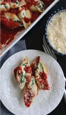  ?? Tns ?? EAT YOUR GREENS: Jumbo shells stuffed with spinach and a trio of cheeses sit in a bed of marinara sauce.