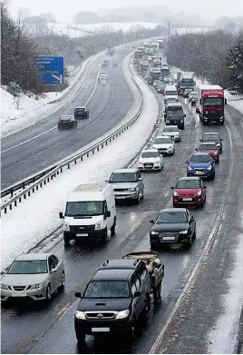  ??  ?? Going nowhere: Cars queued on the M77 in Renfrewshi­re