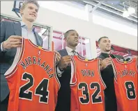  ?? AP PHOTO ?? Chicago Bulls seventh overall draft pick Lauri Markkanen, left, Kris Dunn, centre, and Zach Levine, pose for a photo at the NBA team’s training facility, Tuesday, June 27, 2017, in Chicago. Dunn and Levine was acquired by the Bulls from the Minnesota...