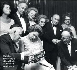  ??  ?? The Queen receiving a silver Bible at the US’s centenary