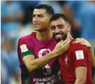  ?? ?? Portugal’s Cristiano Ronaldo and Bruno Fernandes celebrate after the match against Uruguay at the Lusail Stadium on Monday.