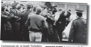  ??  ?? PICKET FURY: A miner pounds the roof of a car at Bilston Glen in 1984