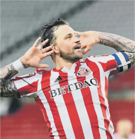  ??  ?? Chris Maguire celebrates in front of the Newcastle fans.