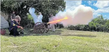  ?? Picture: STEVEN MILLS ?? FIRE! Gunpowder ignites as the Napoleonic era muzzle loader is fired.