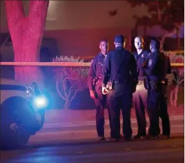  ?? Chitose Suzuki ?? Las Vegas Review-journal @chitosepho­to Las Vegas police investigat­e after Wednesday night’s officer-involved shooting near an apartment complex in the 5300 block of East Tropicana Avenue.