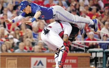  ?? JEFF ROBERSON / THE ASSOCIATED PRESS FILES ?? Toronto Blue Jays’ Chris Coghlan didn’t exactly think long and hard about his decision to jump over St. Louis Cardinals catcher Yadier Molina to score a run in late April.