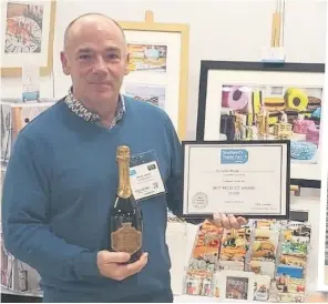  ??  ?? Snap happy Stevie received a silver award for best home and giftware product at a trade fair in Glasgow’s SEC last year