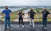  ?? SpaceX/AP ?? ■ In this photo provided by SpaceX, Jared Isaacman, from left to right, Hayley Arceneaux, Sian Proctor and Chris Sembroski pose for a photo Monday from the SpaceX launch tower at NASA’s Kennedy Space Center at Cape Canaveral, Fla.