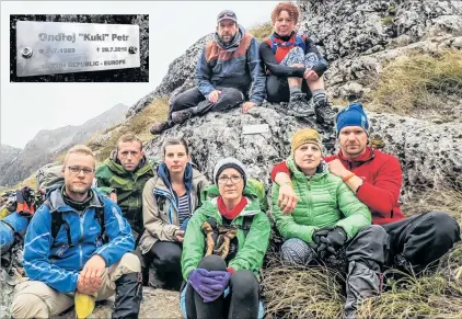  ?? PHOTOS: VLADKA KENNETT ?? Rememberin­g Ondrej . . . Surroundin­g the newly installed plaque (inset) to Czech tramper Ondrej Petr, by the Routeburn Track on Ocean Peak, are (front, from left) Pavel Horn´ık, Lada Nobilisova, Roman Cepa, Veronika Fejfarova, Edita Vihanova and Lukas Nechuta, all of Queenstown, and (back) David Sanc, of Auckland, and Vladka Kennett, of Glenorchy.