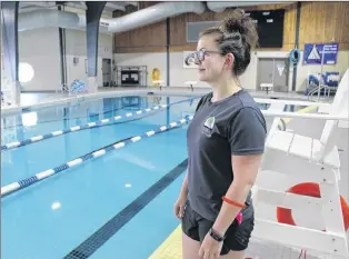  ?? ASHLEY FITZPATRIC­K/THE TELEGRAM ?? Lifeguard/instructor Nicole Tilley prepares for the arrival of swimmers at the pool in the Conception Bay South Recreation Complex on Thursday morning. The pool reopened this week after an extended maintenanc­e period.