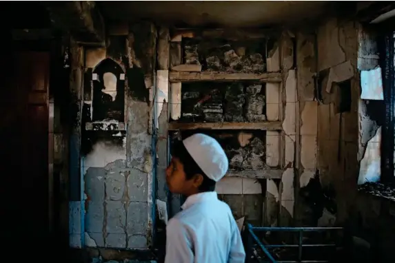  ?? (AP) ?? A mosque burnt last year in the riots in northeast Delhi