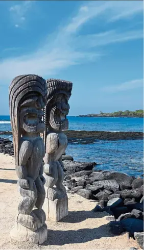  ??  ?? The sacred ground of Puuhonua o Honaunau National Historical Park. The temple of Hale o Keawe is guarded by fierce wood-carved statutes called kii.