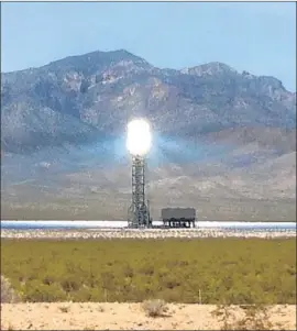  ?? Carolyn Cole Los Angeles Times ?? CALIFORNIA has a surplus of solar power after a surge of rooftop panels and large gathering systems. Above, a solar plant near the California-Nevada border.