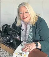  ??  ?? Christina Mckelvie with her mum’s Singer sewing machine