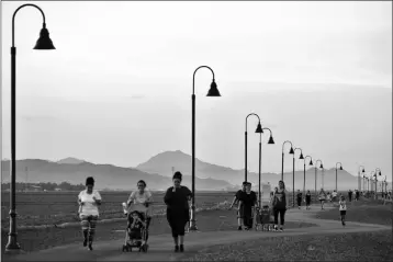  ?? FILE PHOTO ?? RESIDENTS WALK AND JOG on a walking track along Cesar Chavez Avenue in Somerton.