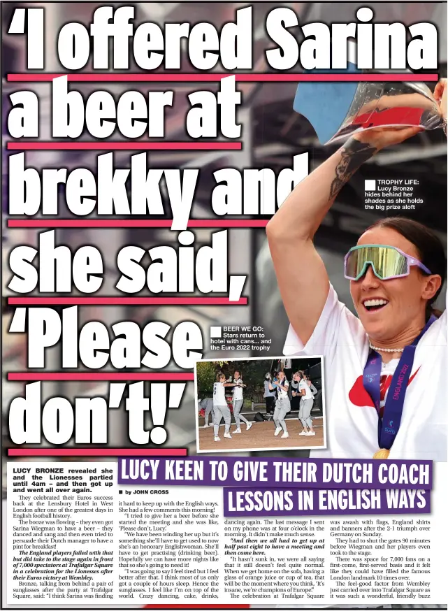  ?? ?? ■ TROPHY LIFE: Lucy Bronze hides behind her shades as she holds the big prize aloft