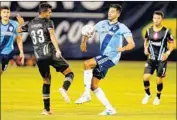  ?? Kiel Maddox ?? FOXES FORWARD Pedro Ribeiro, right, vies for the ball against the Light’s Miguel Angel Garundo.