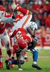  ??  ?? Kansas City Chiefs running back Darrel Williams (31) is tackled by Indianapol­is Colts cornerback Kenny Moore (23) during the first half of an NFL divisional football playoff game in Kansas City.