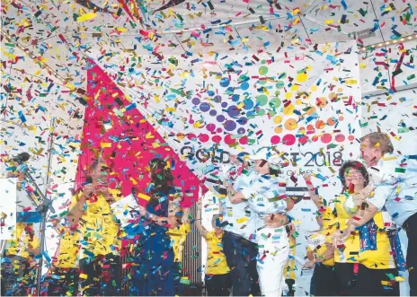  ??  ?? Fans at the Broadwater Parklands react to the Gold Coast being awarded the 2018 Commonweal­th Games.