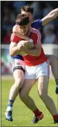  ??  ?? TANGLED IN BLUE: Louth’s Patrick Reilly