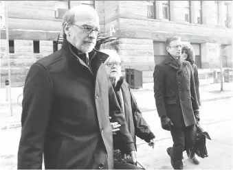  ?? NATHAN DENETTE/THE CANADIAN PRESS ?? David Livingston, left, a former top political aide in Ontario, leaves court with supporters in Toronto on Friday. Livingston has been found guilty of illegally destroying documents related to a controvers­ial government decision to cancel two gas...