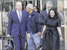  ?? JEFF CHIU / ASSOCIATED PRESS ?? Robert Giuffra (left), an attorney for Volkswagen, leaves the Phillip Burton Federal Building in San Francisco on Tuesday. Several angry Volkswagen owners told a federal judge Tuesday that a $10 billion settlement does not adequately compensate them...