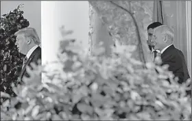  ?? AP/PABLO MARTINEZ MONSIVAIS ?? White House chief of staff John Kelly (right) watches as President Donald Trump leaves the Oval Office on Friday to head off for the weekend to Bedminster, N.J.