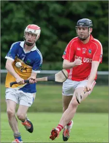  ??  ?? Ballyhooly’s Fintan Lenihan plays a short clearance as Kilworth’s Michael Wade tries to hook him during the first half of last weekend’s North Cork Junior A Hurling Championsh­ip game in Mitchelsto­wn Photo by Eric Barry/Blink Of An Eye