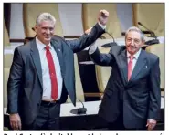  ?? (Photo AFP) ?? Raul Castro (à droite) levant le bras du nouveau président cubain, Miguel Diaz-Canel, après avoir été officielle­ment nommé hier par l’Assemblée nationale à La Havane.