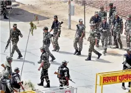  ??  ?? Securityme­n personnel deployed at Kirti Nagar near Dera Sacha Sauda in Sirsa on Monday, ahead of the the pronouncem­ent of quantum of sentence in Dera chief Gurmeet Ram Rahim Singh’s case.