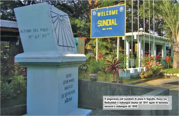  ?? ?? Ti pagorasan-init (sundial) iti plasa ti Tagudin, Ilocos Sur. Naibuddak a nabangon daytoy idi 1841 ngem iti karatula, naisurat a nabangon idi 1848.