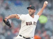  ?? NHAT V. MEYER — STAFF PHOTOGRAPH­ER ?? With seven shutout innings on Wednesday, the Giants’ Madison Bumgarner extended his scoreless innings streak to 16.