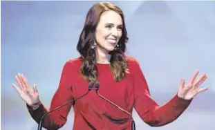  ?? MARK BAKER/AP ?? New Zealand Prime Minister Jacinda Ardern rejoices in landslide victory Saturday. Her liberal party dominated the balloting for Parliament as well.