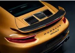  ??  ?? clockwise from top right Rear wing borrowed from the otherwise optional Aerokit that costs R97 700 for the normal Turbo S; bespoke 20-inch wheels with gold detailing can be toned down; gold stitching lifts standard Chronopack­aged interior above the...