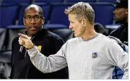  ?? MARCIO JOSE SANCHEZ / ASSOCIATED PRESS ?? The Warriors’ Mike Brown (left), twice a head coach of the Cavaliers in past seasons, will fill in for the ailing Steve Kerr tonight in Game 1.