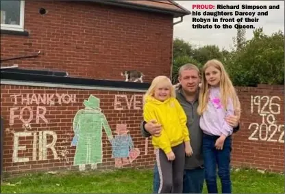  ?? ?? PROUD: Richard Simpson and his daughters Darcey and Robyn in front of their tribute to the Queen.