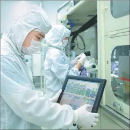  ?? PROVIDED TO CHINA DAILY ?? Engineers at work at the photoelect­ric semiconduc­tor manufactur­ing base of Osram in Wuxi, Jiangsu