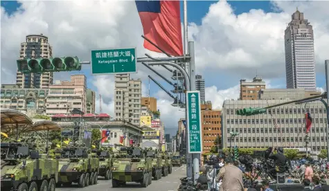  ?? LAM YIK FEI/THE NEW YORK TIMES ?? Military vehicles in a parade in Taipei, Taiwan, on Oct. 10, 2021. President Joe Biden indicated he would use military force to defend Taiwan if it were ever attacked by China.