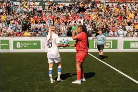  ?? ?? American forward Sienna Jackson (in red) moments before kickoff at the Hornet Stadium in Sacramento, California. Photograph: Dan Higginson/Courtesy Homeless World Cup