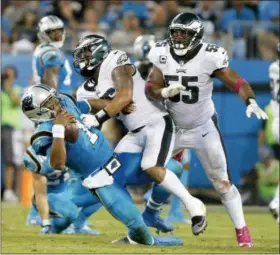  ?? BOB LEVERONE — THE ASSOCIATED PRESS ?? The Eagles’ Derek Barnett, center, and Brandon Graham did a good job bottling up Cam Newton in a 28-23 win in Carolina last year. To beat the Panthers Sunday at the Linc, they’ll again have to keep Newton in check.