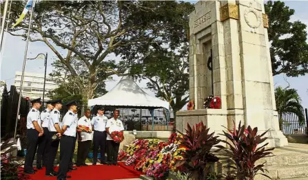  ??  ?? Paying respects: Army veterans and officers attending the Annual Remembranc­e Day ceremony at the Esplanade’s Cenotaph.