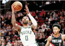  ?? — AFP photo ?? Lillard shoots against Anfernee Simons of the Portland Trail Blazers.