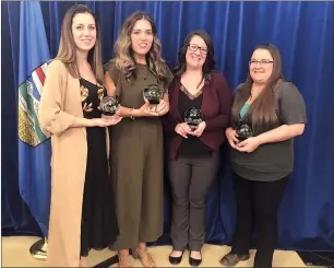  ?? SUBMITTED PHOTO ?? Representa­tives from Little Owl Learning Centre stand with their Awards of Excellence Friday after a ceremony in Edmonton.