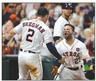  ?? AP/DAVID J. PHILLIP ?? Houston’s Jose Altuve (right) is congratula­ted by teammate Alex Bregman after hitting a home run Saturday against the Yankees in Houston.