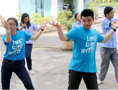  ??  ?? Bryan (right) joins in a Zumba Dance on World Autism Awareness Day.