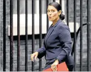  ?? ALASTAIR GRANT / ASSOCIATED PRESS ?? Priti Patel, then Britain’s secretary of state for internatio­nal developmen­t, reacts to amedia question lastmonth as she arrived for a Cabinetmee­ting at 10 Downing Street in London.