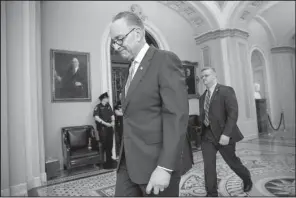  ?? AP/ J. SCOTT APPLEWHITE ?? Senate Minority Leader Charles Schumer heads to his office Thursday. “The nuclear option means the end of a long history of consensus” on high court nominees, Schumer said after Thursday’s rule change.