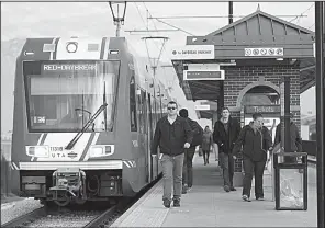  ?? AP/The Deseret News/KRISTIN MURPHY ?? People get off a train earlier this month in Midvale in Utah, a state where cities proposed sites and pitched their communitie­s as potential locations for Amazon’s second headquarte­rs.