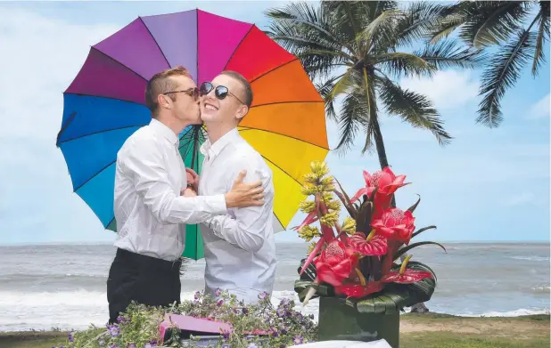  ??  ?? HAPPY COUPLE: Ilya Artemenko and Alexander Grishyn at Turtle Cove. They are hoping to get married if the same-sex marriage plebiscite is successful. Picture: ANNA ROGERS
